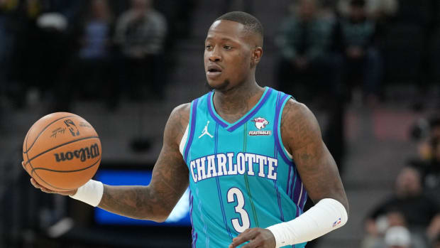 Hornets guard Terry Cozier dribbles the ball down the court.